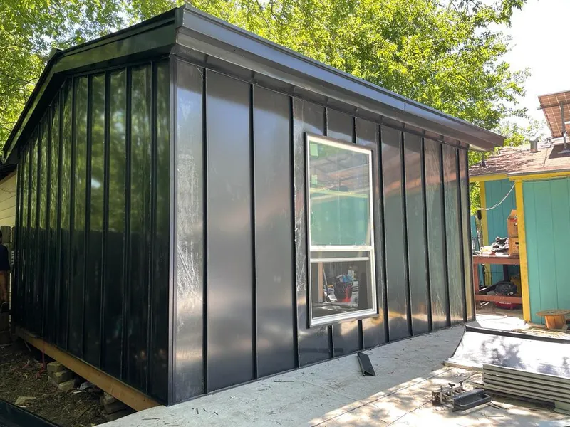 Black standing seam metal wall panels for Roof Inspection in Ste. Genevieve