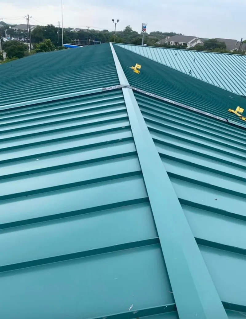 Green commercial metal roof ridge and valley for Metal Roof Repair in Ste. Genevieve
